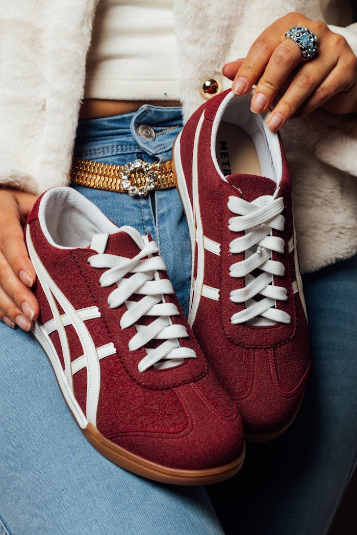 Bold red women's sneakers paired with a stylish outfit, enhancing modern casual fashion.